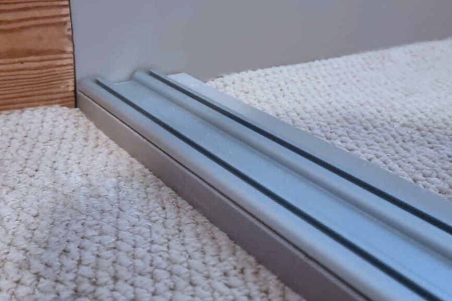 Sliding door track: Sliding glass door track cleaned and restored so the panel glides again.
